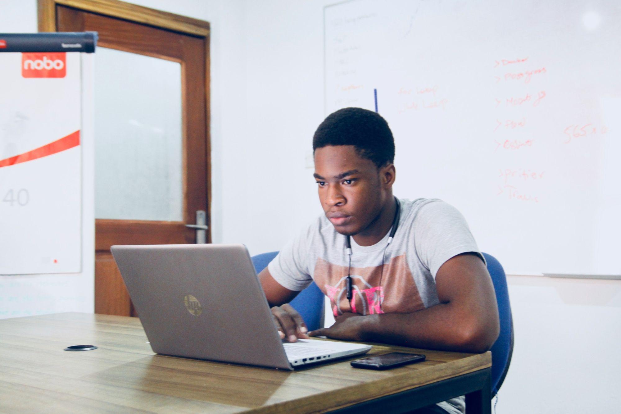 man sits at computer