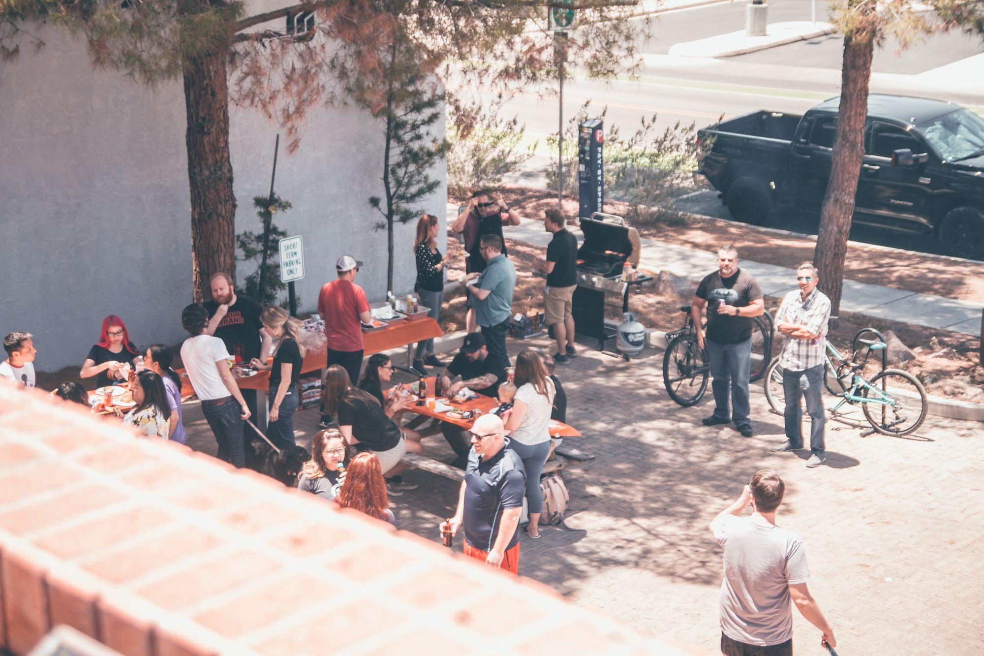 a group of colleagues gather for a cookout